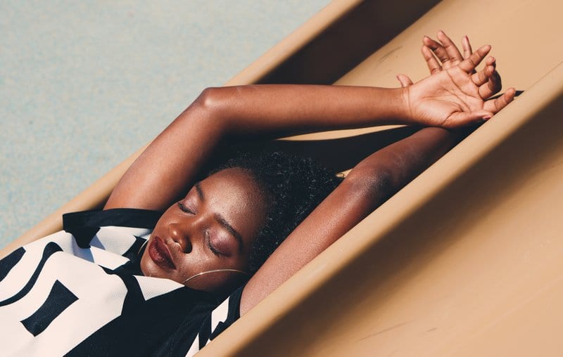 Woman lying down with eyes closed