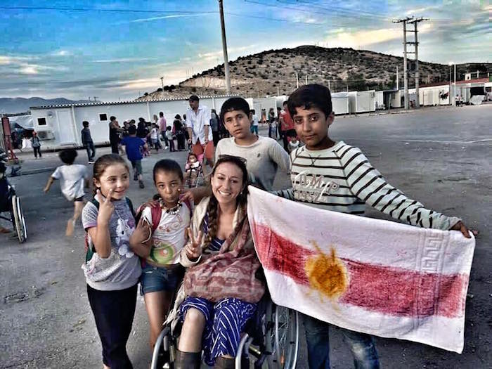 refugee children with woman in wheelchair rebekah uccellini kuby