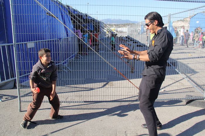 adil with refugee child