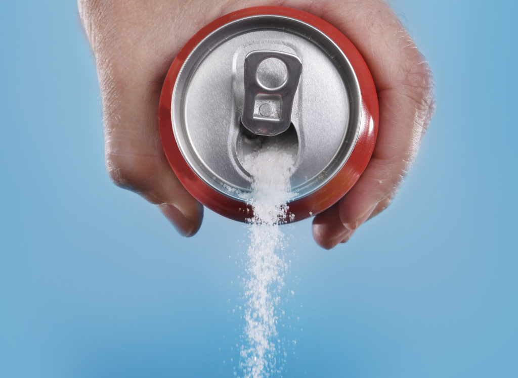 coca cola pours out sugar